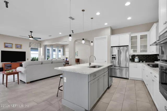a view of a livingroom with workspace and a window
