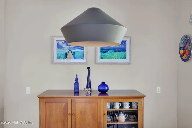 a bedroom with a bed and a mirror