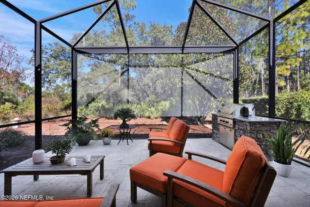 a living room with furniture gym equipment and a large window