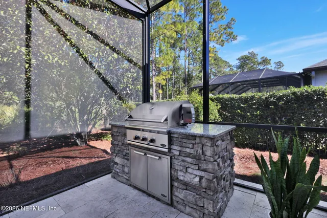 a view of a swimming pool with a yard and sitting area