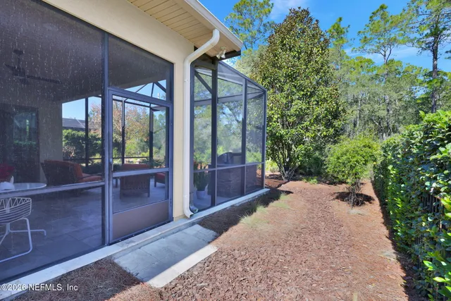 a view of a swimming pool with a patio and a yard