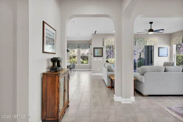 a view of a dining room with furniture and window