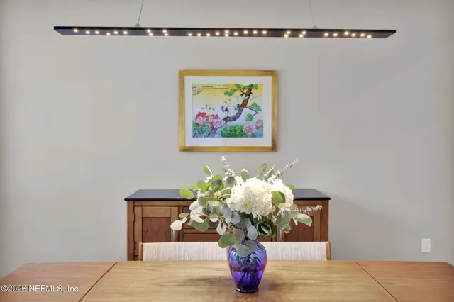 a living room with furniture a dining table and kitchen view