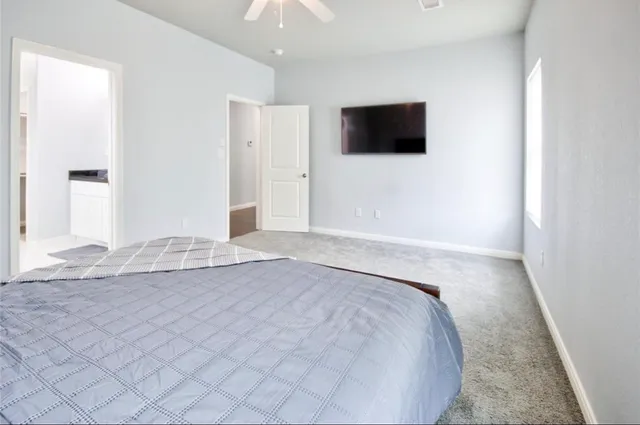 a view of a livingroom with wooden floor and flat screen tv