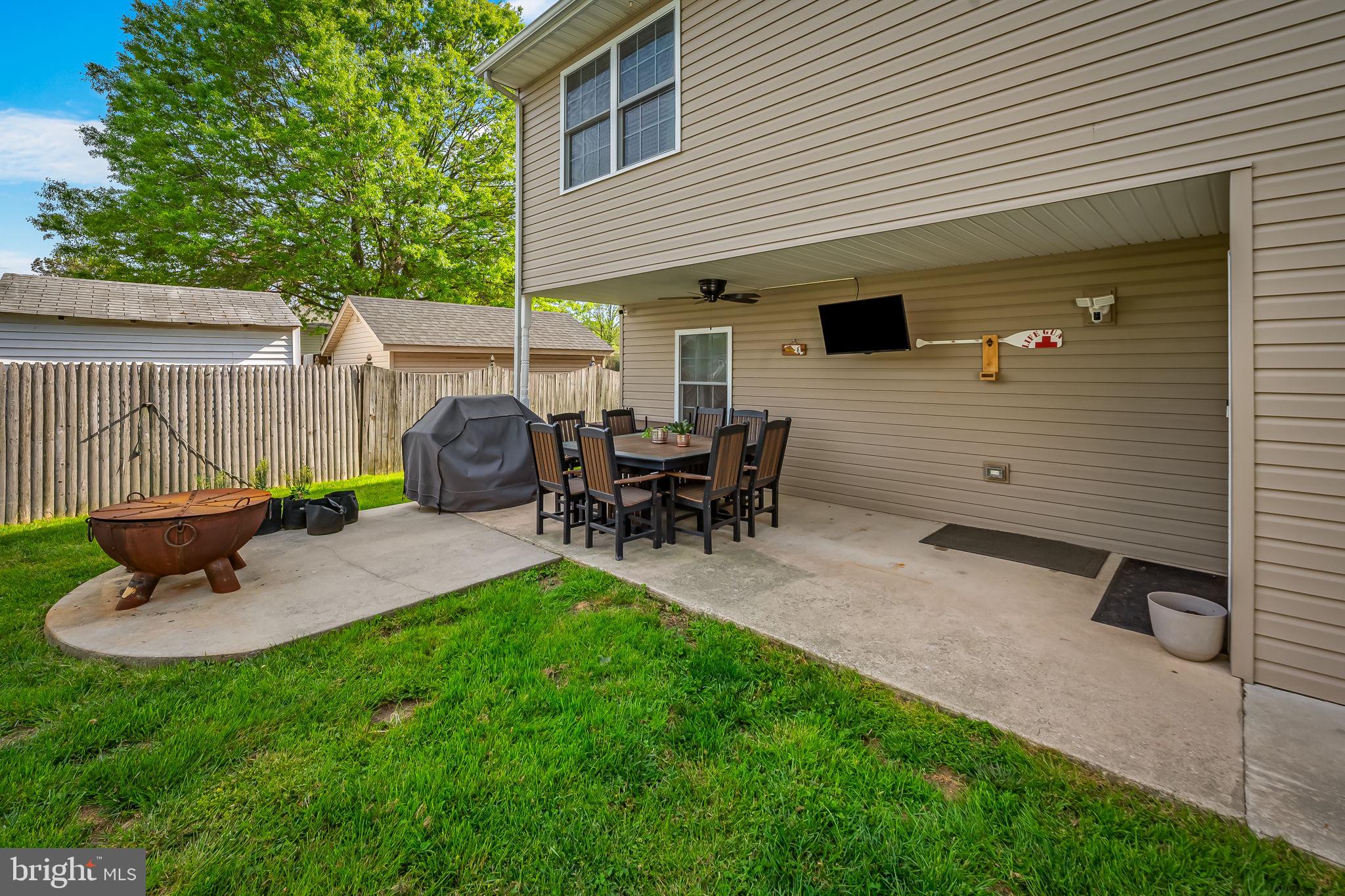 7216 Gunpowder Road Baltimore, MD 21220 - Photo 18 of 23 a backyard of a house with table and chairs