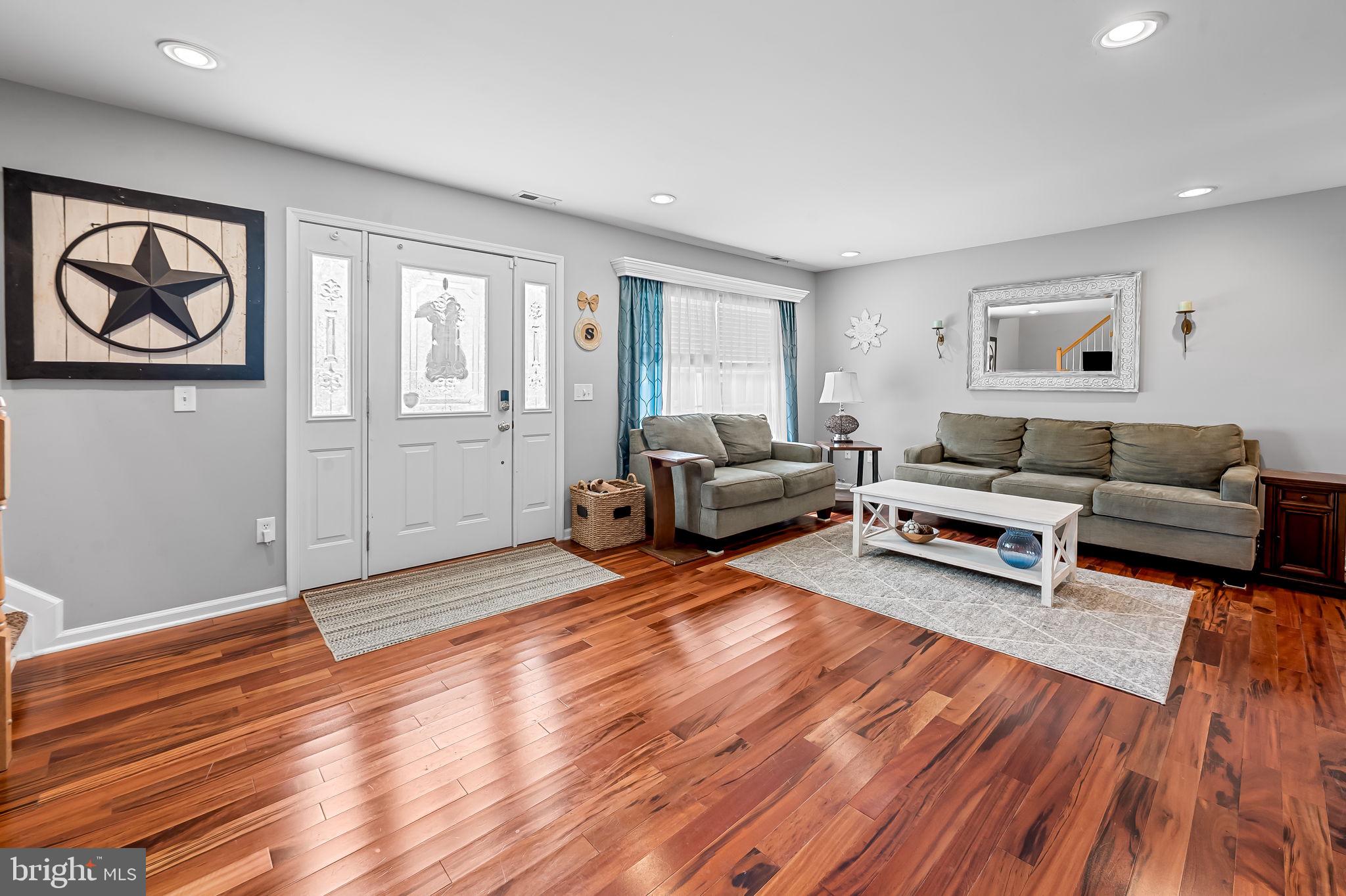 7216 Gunpowder Road Baltimore, MD 21220 - Photo 3 of 23 a living room with furniture and a wooden floor