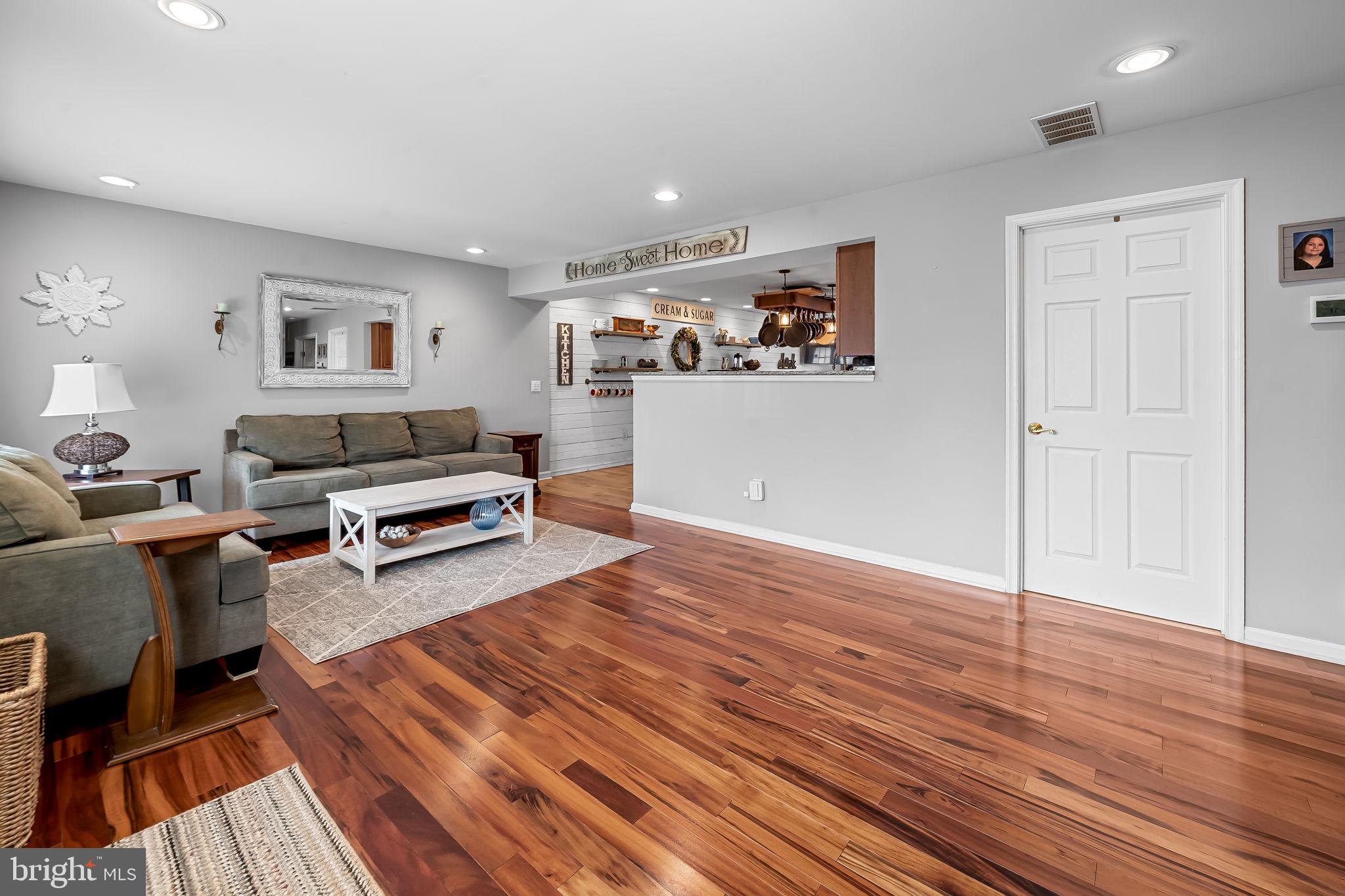 7216 Gunpowder Road Baltimore, MD 21220 - Photo 5 of 23 a view of a livingroom with furniture and wooden floor