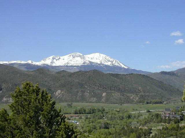 250 Ridge Road Basalt, CO 81621 - Photo 2 of 3 a view of a house with a mountain and a forest