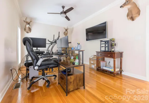 a view of a livingroom with furniture and a flat screen tv