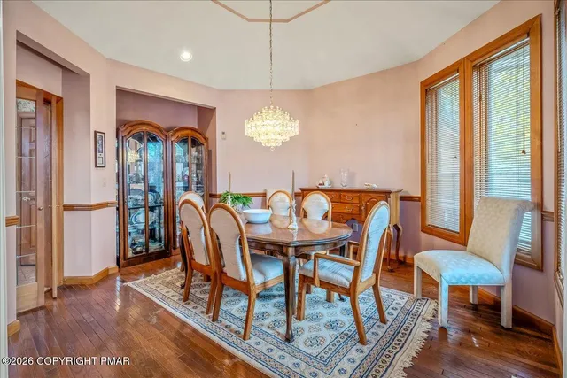 a dining room with furniture window wooden floor