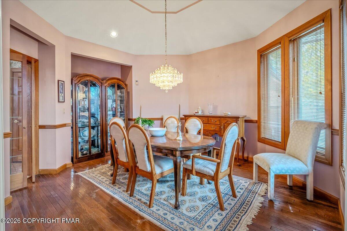 144 Ladderback Lane Cresco, PA 18326 - Photo 11 of 49 a view of a dining room with furniture window and wooden floor