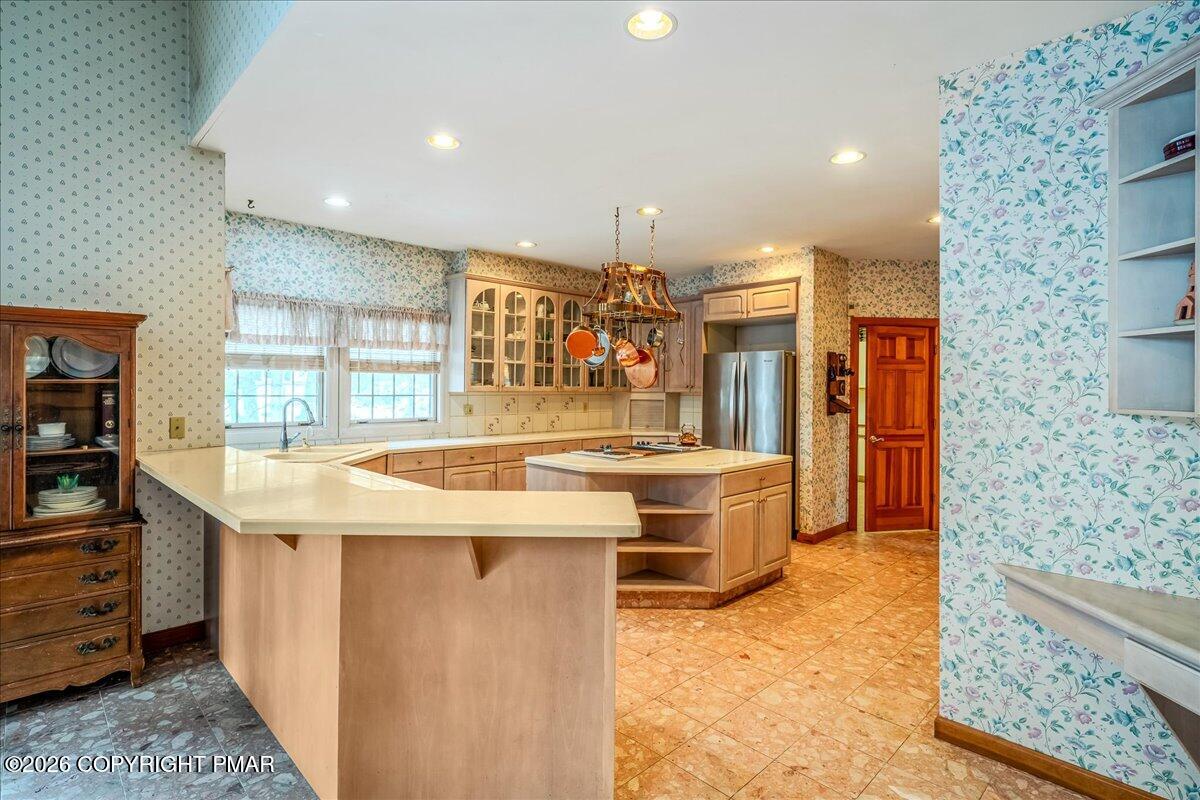 144 Ladderback Lane Cresco, PA 18326 - Photo 14 of 49 a kitchen with stainless steel appliances granite countertop a sink and cabinets