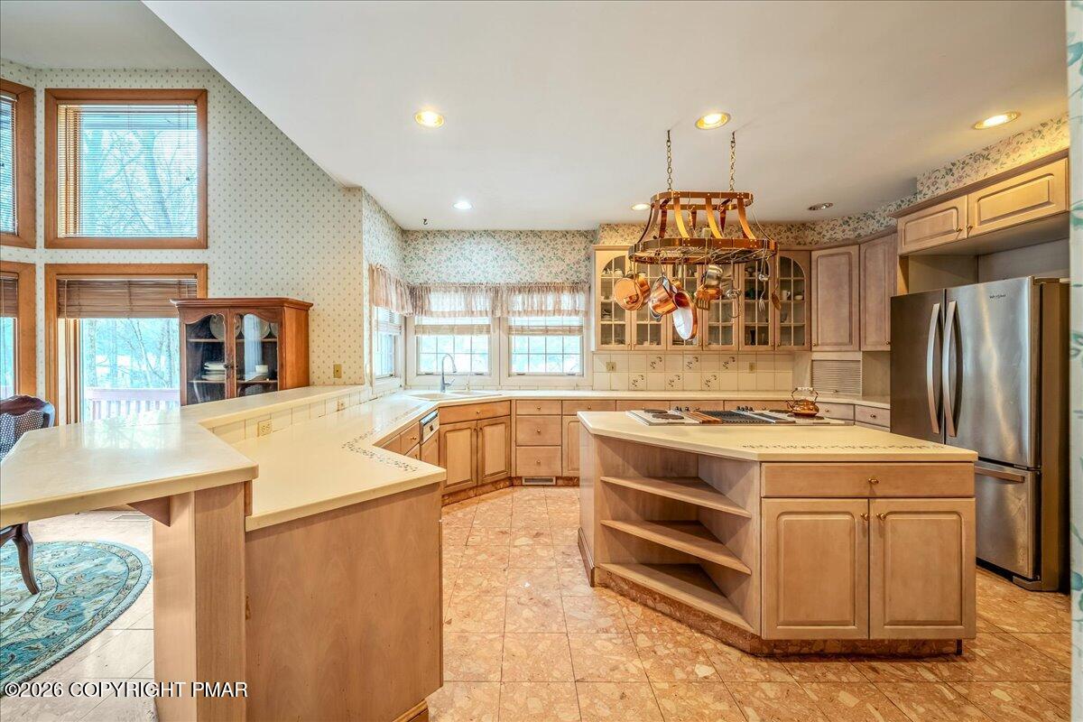 144 Ladderback Lane Cresco, PA 18326 - Photo 15 of 49 a kitchen with stainless steel appliances granite countertop a stove and a refrigerator
