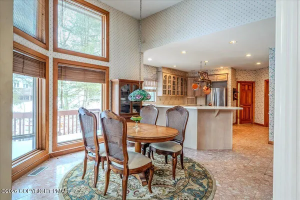 a dining room with furniture window wooden floor