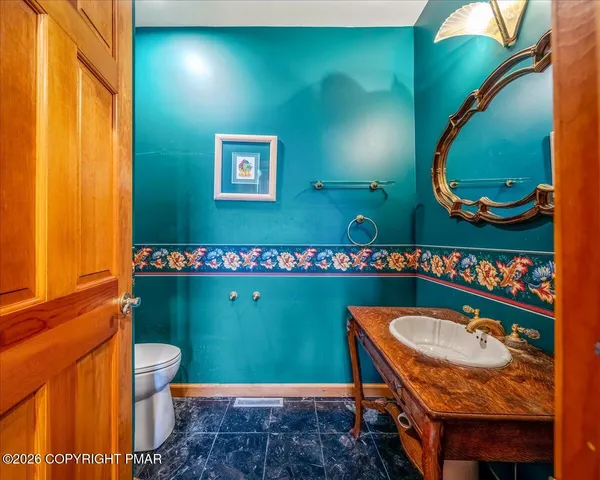 a living room with fireplace furniture and a flat screen tv