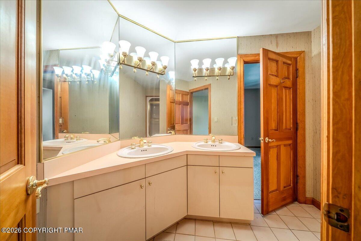 144 Ladderback Lane Cresco, PA 18326 - Photo 28 of 49 a bathroom with a sink and mirror