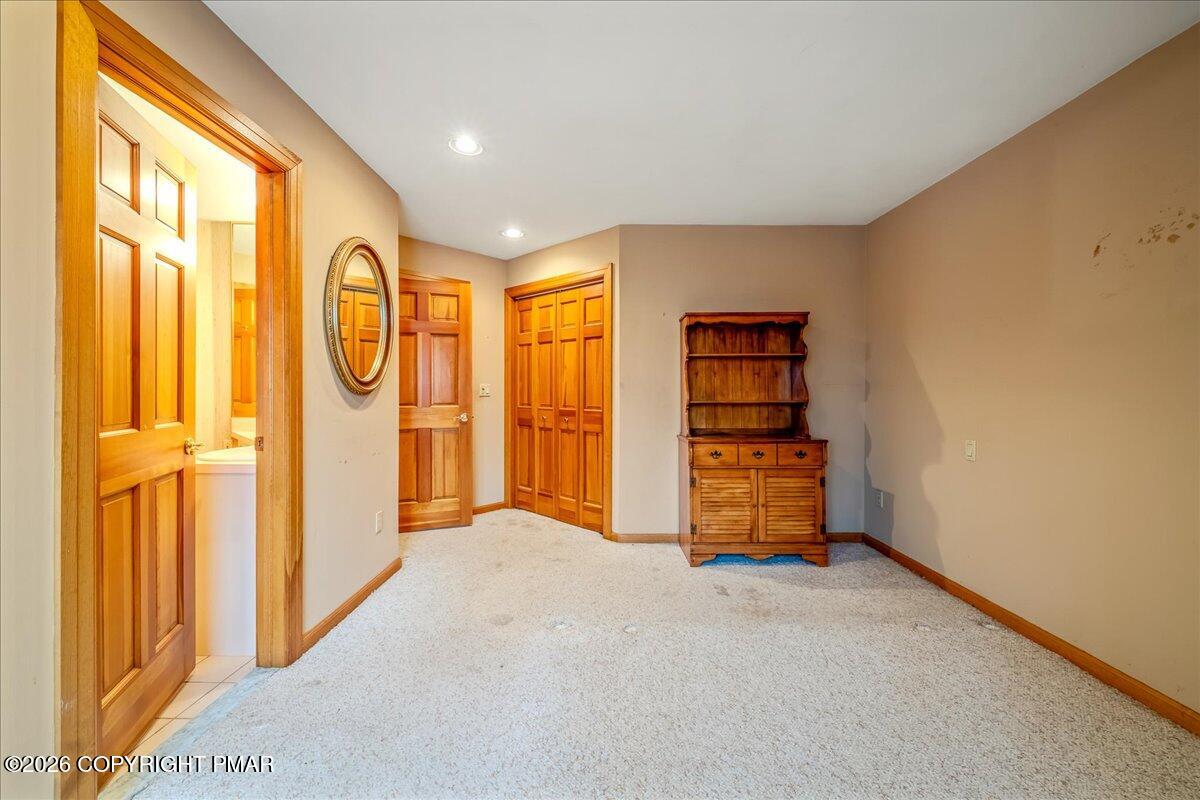 144 Ladderback Lane Cresco, PA 18326 - Photo 32 of 49 a view of an empty room with wooden floor and a window