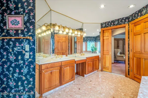 a bathroom with a bathtub and shower