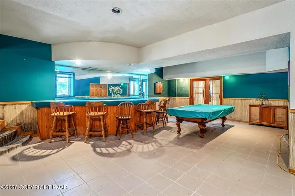 a living room with furniture and a table