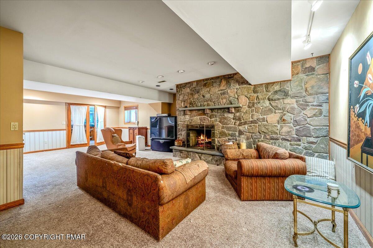 144 Ladderback Lane Cresco, PA 18326 - Photo 43 of 49 a living room with fireplace furniture and a flat screen tv