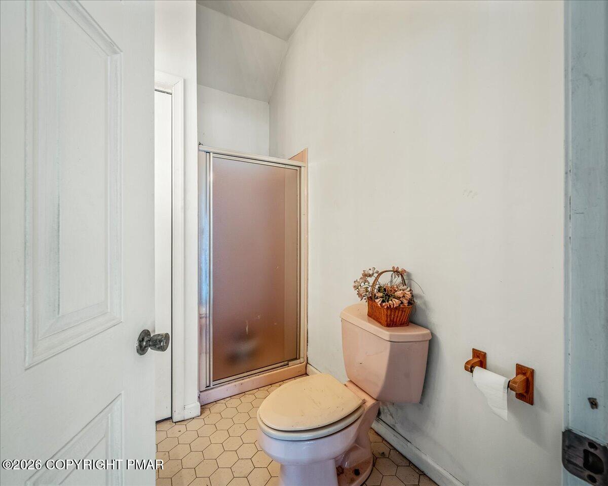 144 Ladderback Lane Cresco, PA 18326 - Photo 45 of 49 a white toilet sitting next to a bathroom sink