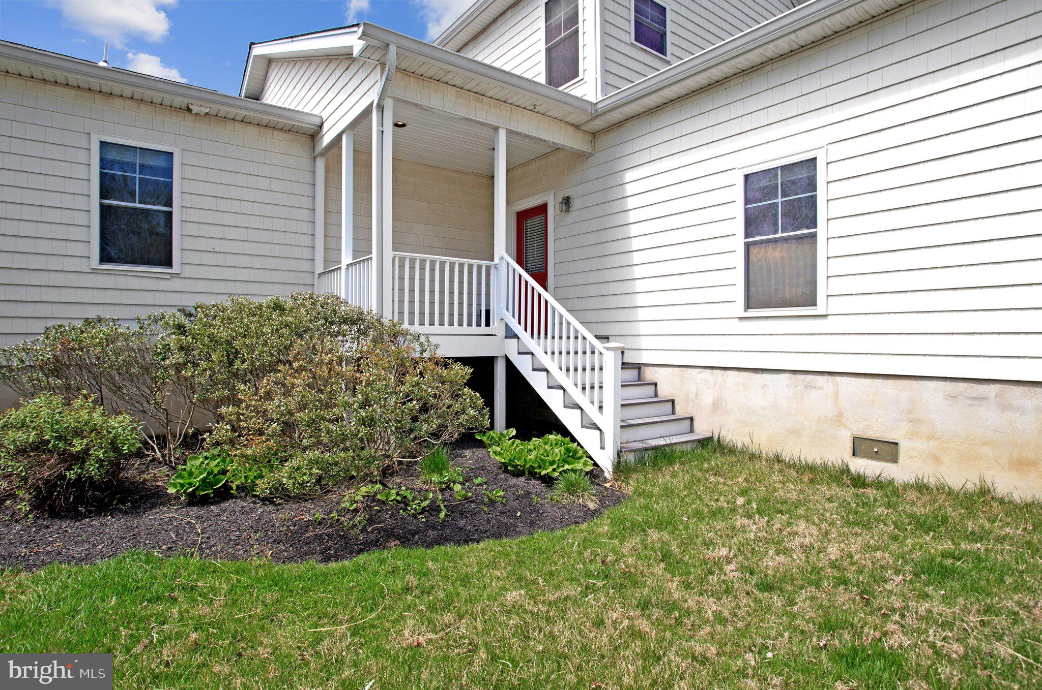 6146 Drum Point Road Deale, MD 20751 - Photo 70 of 75 a view of a house with a yard and sitting area