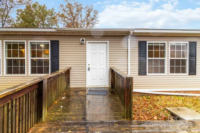 a front view of a house with large windows