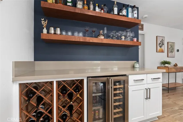 a kitchen with counter top space a sink appliances and cabinets