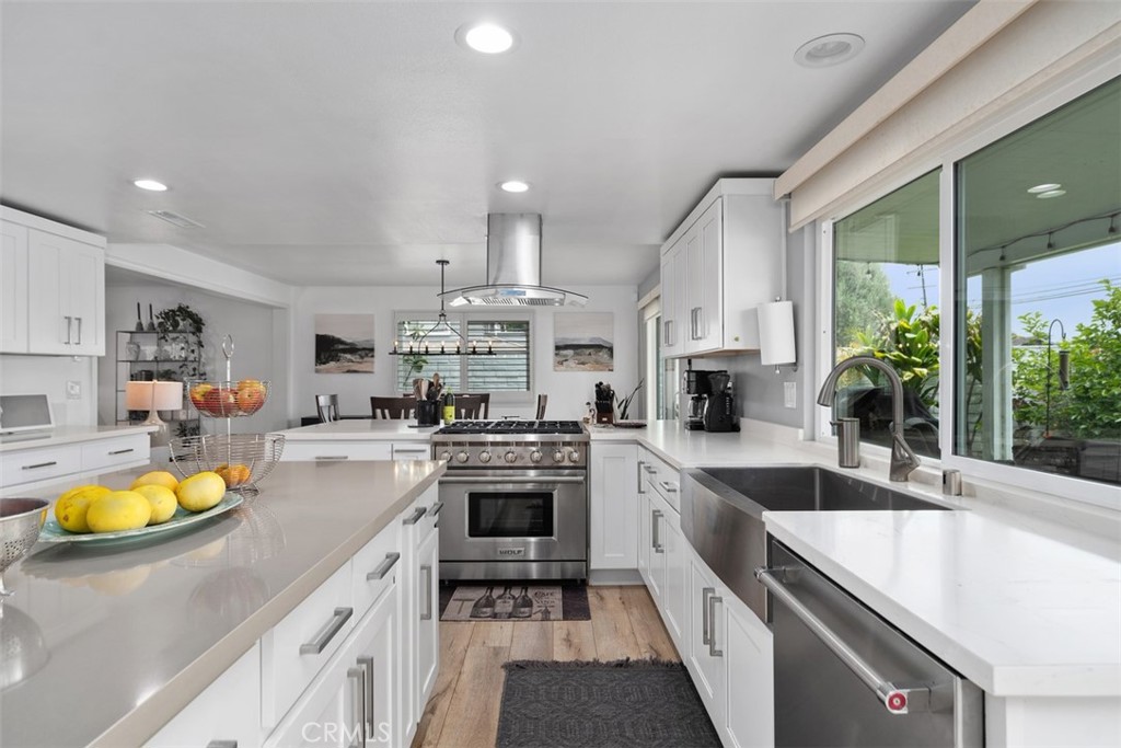 13772 Ridgecrest Circle Tustin, CA 92780 - Photo 16 of 39 a kitchen with counter top space a sink and appliances