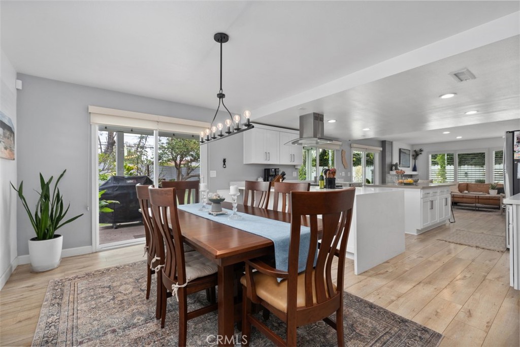 13772 Ridgecrest Circle Tustin, CA 92780 - Photo 17 of 39 a view of a dining room with furniture window and wooden floor