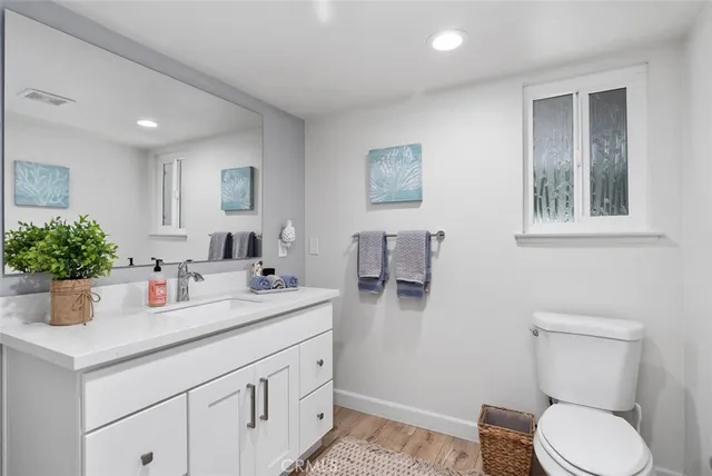 a bedroom with a bed and a television