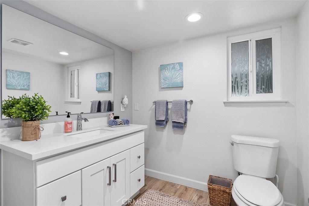 13772 Ridgecrest Circle Tustin, CA 92780 - Photo 18 of 39 a bathroom with a toilet sink and mirror