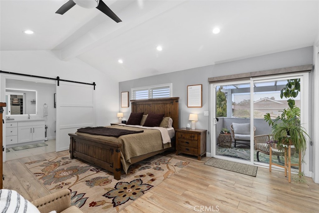 13772 Ridgecrest Circle Tustin, CA 92780 - Photo 19 of 39 a bedroom with a bed and a chandelier