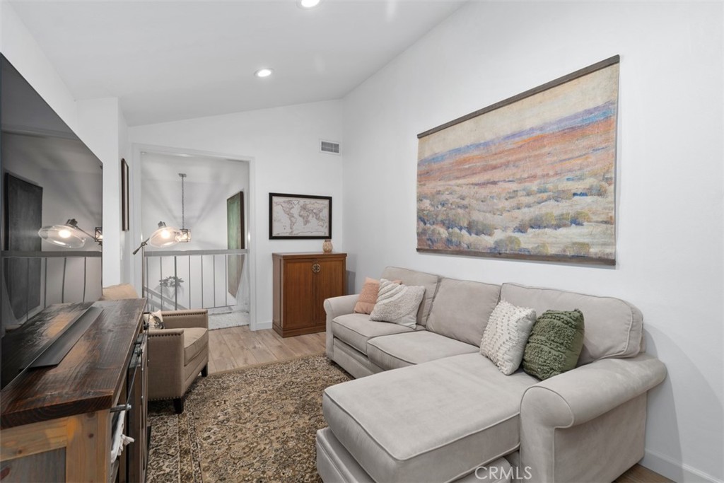 13772 Ridgecrest Circle Tustin, CA 92780 - Photo 27 of 39 a living room with furniture and a view of kitchen