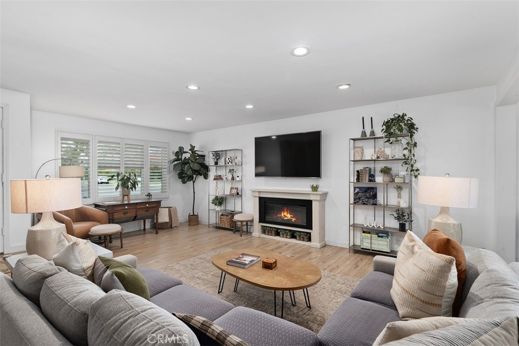13772 Ridgecrest Circle Tustin, CA 92780 - Photo 5 of 39 a living room with furniture and a fireplace