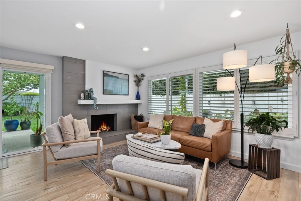 13772 Ridgecrest Circle Tustin, CA 92780 - Photo 10 of 39 a living room with furniture fireplace and potted plants