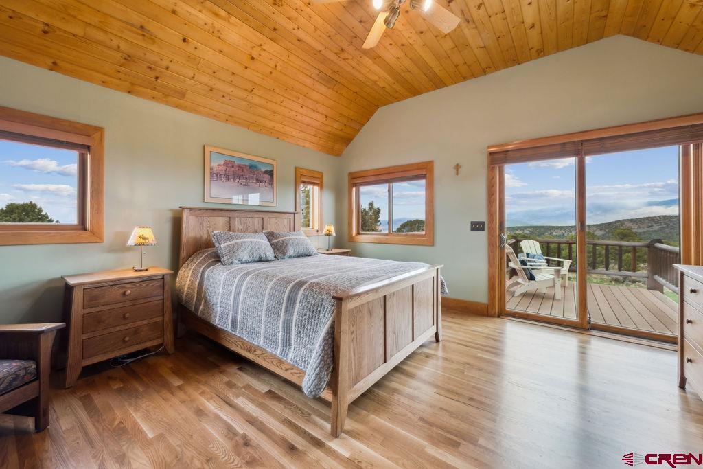 948 Sage Road Montrose, CO 81403 - Photo 11 of 45 a bedroom with a large bed and a large window