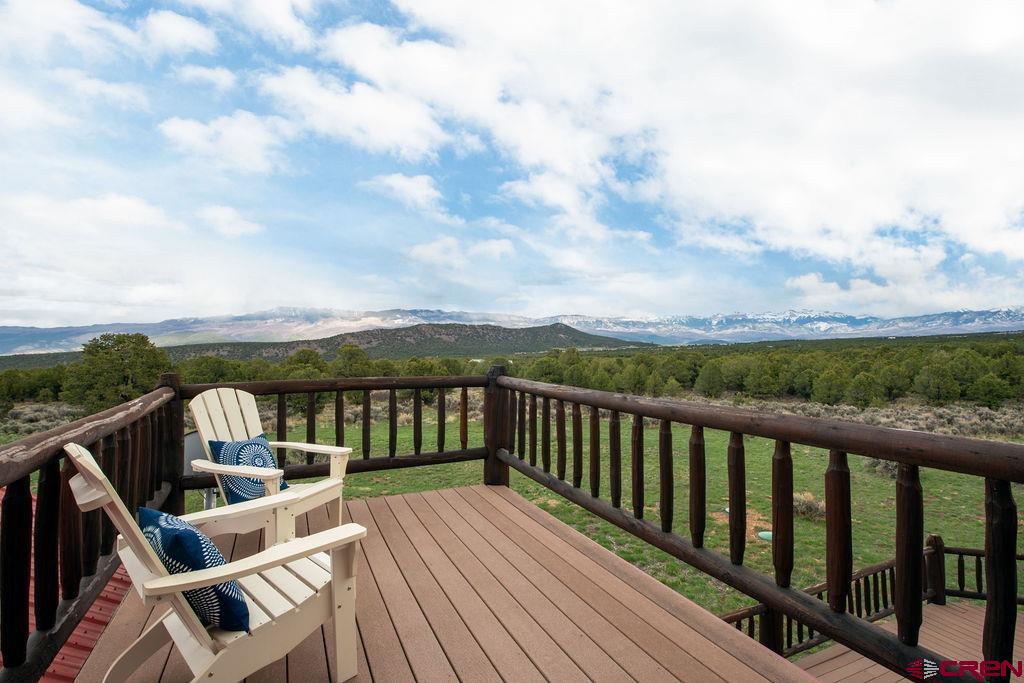 948 Sage Road Montrose, CO 81403 - Photo 14 of 45 a view of balcony with wooden floor and fence