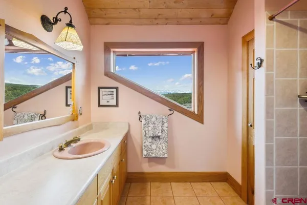 a bathroom with a sink a bathtub and a shower