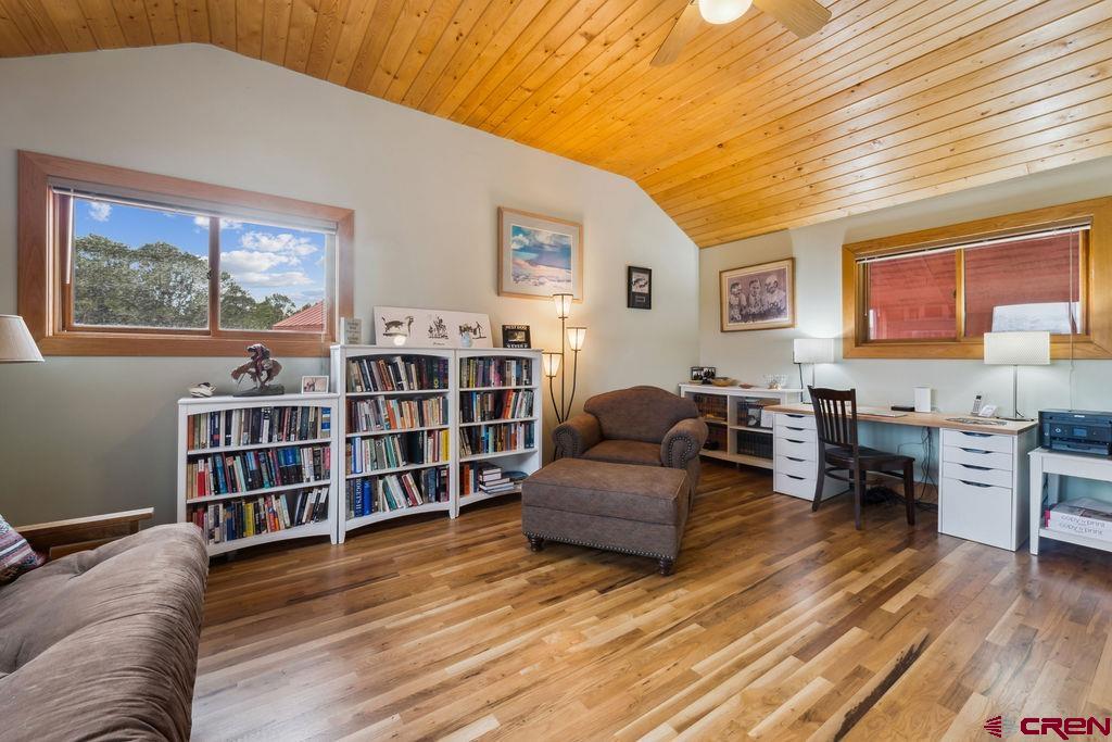 948 Sage Road Montrose, CO 81403 - Photo 20 of 45 a living room with furniture and a wooden floor