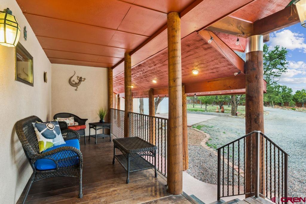 948 Sage Road Montrose, CO 81403 - Photo 22 of 45 a view of a porch with furniture