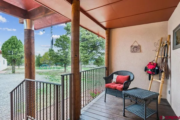 a view of a balcony with furniture