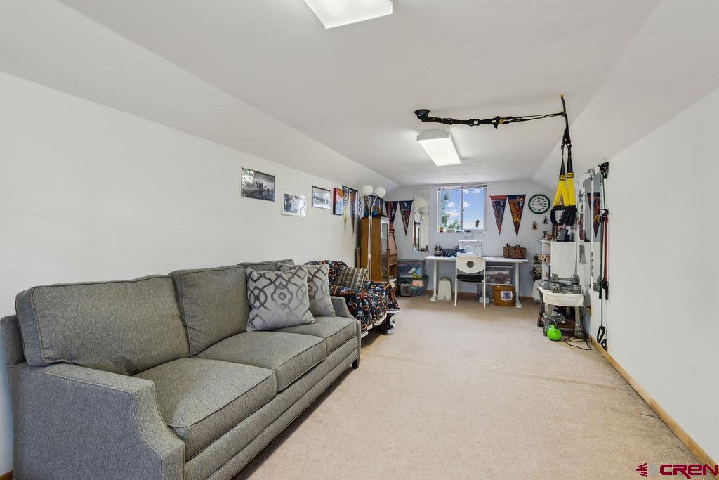 948 Sage Road Montrose, CO 81403 - Photo 26 of 45 a living room with furniture and a couch