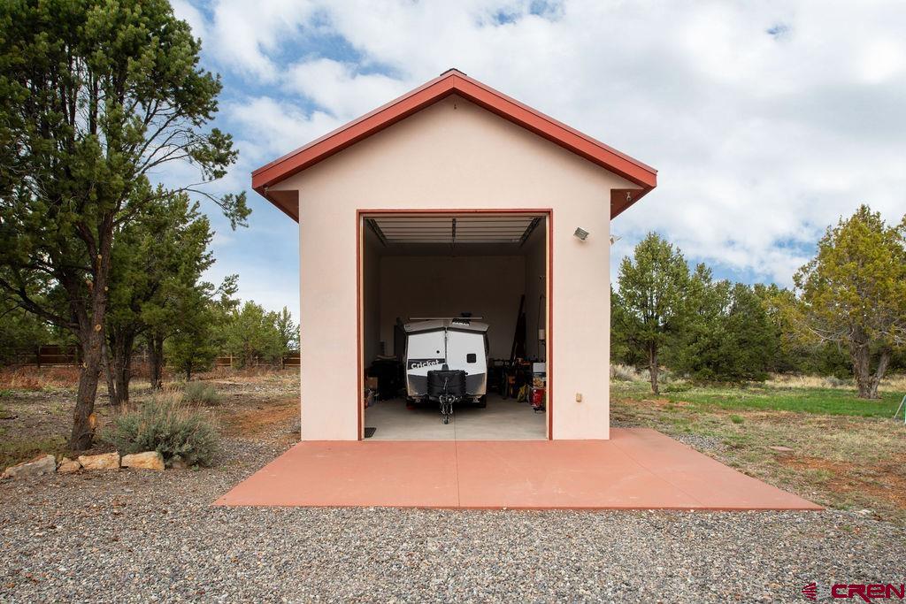 948 Sage Road Montrose, CO 81403 - Photo 29 of 45 a front view of a house with a yard