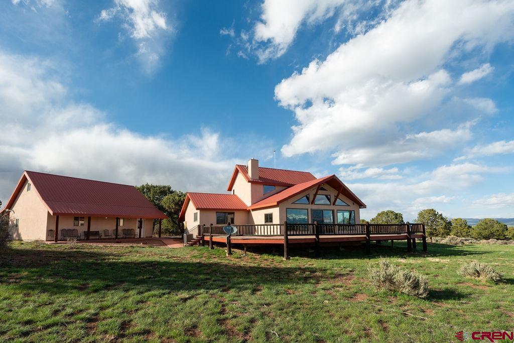 948 Sage Road Montrose, CO 81403 - Photo 30 of 45 a front view of house with yard and green space