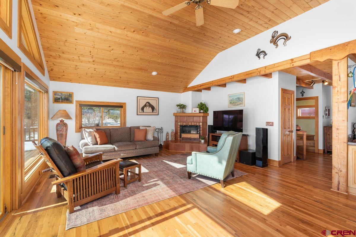 948 Sage Road Montrose, CO 81403 - Photo 3 of 45 a living room with furniture and a flat screen tv