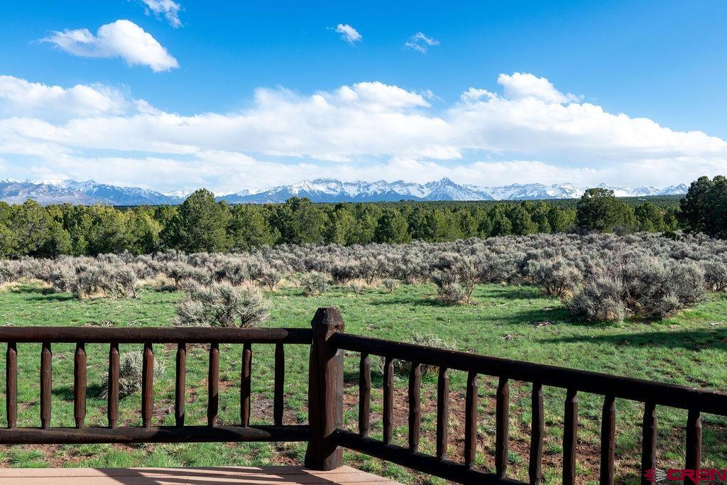 948 Sage Road Montrose, CO 81403 - Photo 34 of 45 a view of a green field with sitting in background