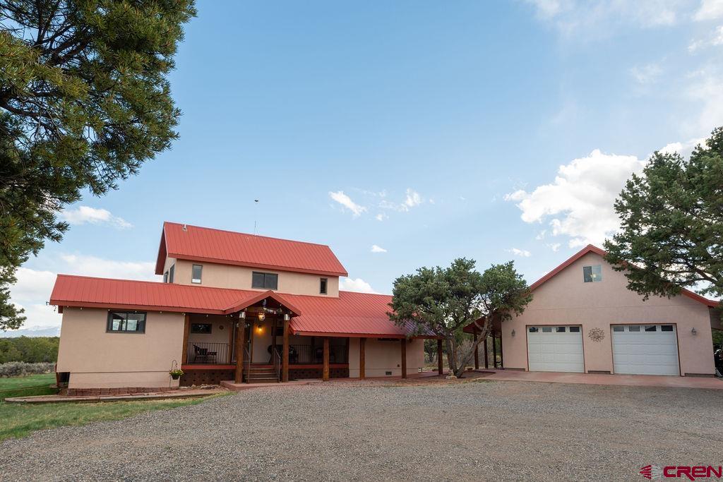 948 Sage Road Montrose, CO 81403 - Photo 44 of 45 a front view of a house with garden