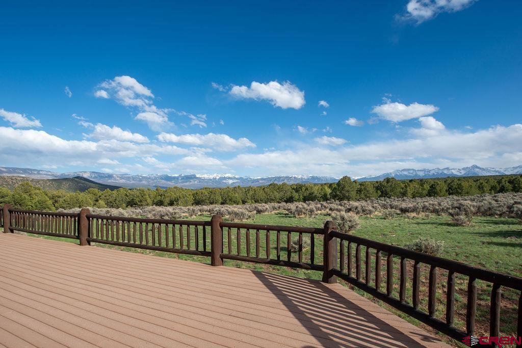 948 Sage Road Montrose, CO 81403 - Photo 8 of 45 a view of balcony with wooden floor & fence