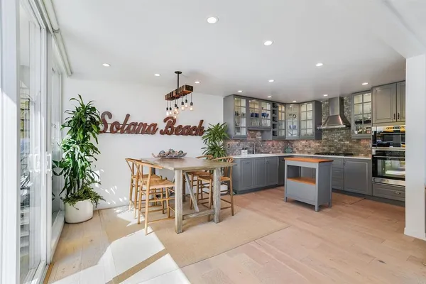 a kitchen with a table and chairs in it